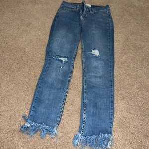 Free People blue jeans with fringe bottoms